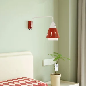 Panama wall lamp mounted in bedroom bedside area with green wall and checkered bedding mid-century styling