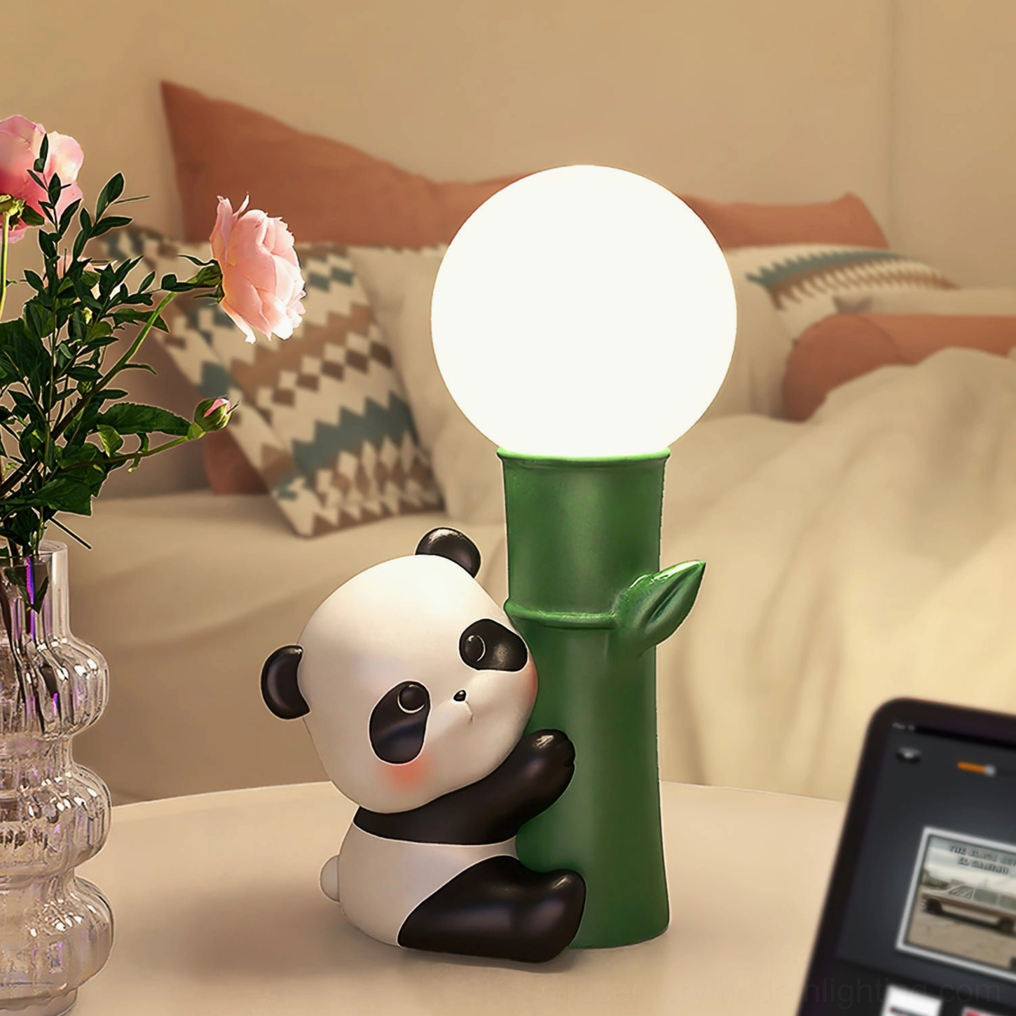 Panda Bamboo Table Lamp on bedroom dresser with glass vase and warm bedding