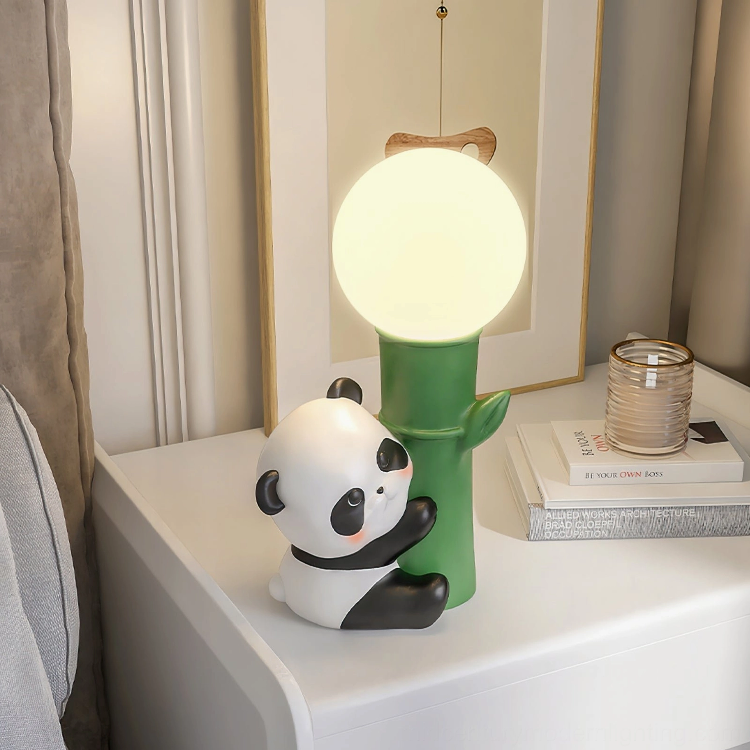 Panda Bamboo Table Lamp on white bedside table with stacked books and contemporary styling