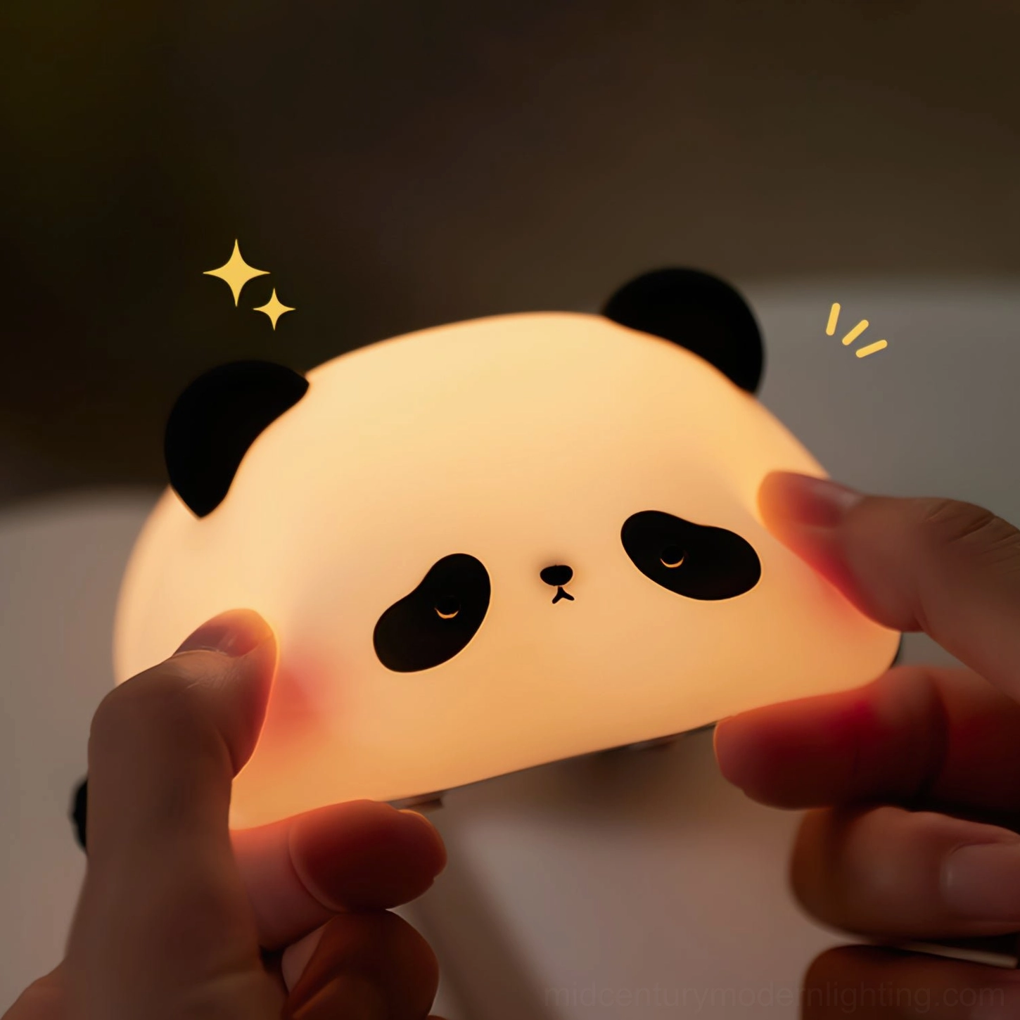 Panda silicone night light held in hands showing tactile soft texture and touch control