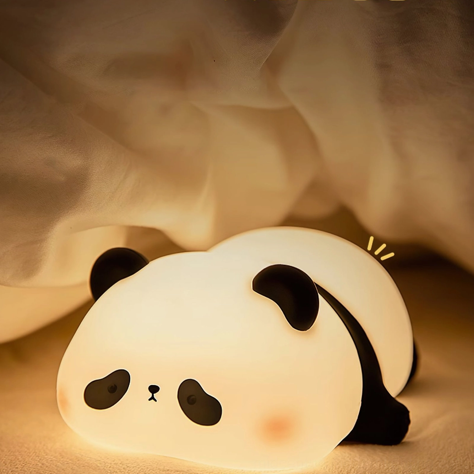 Hand touching panda night light on wooden desk, demonstrating one-touch control feature
