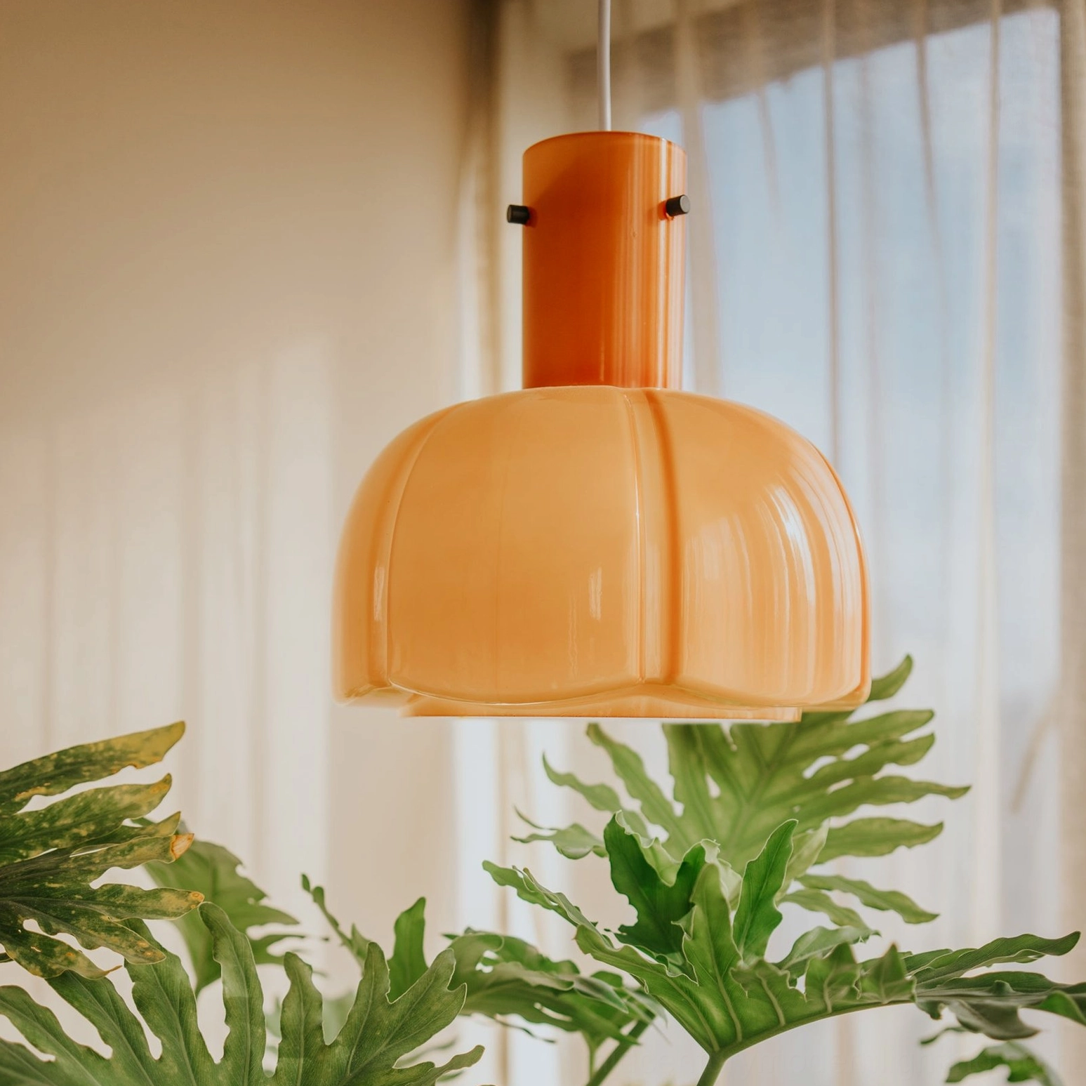 Cream colored Paolina glass pendant light warm neutral finish in farmhouse interior setting