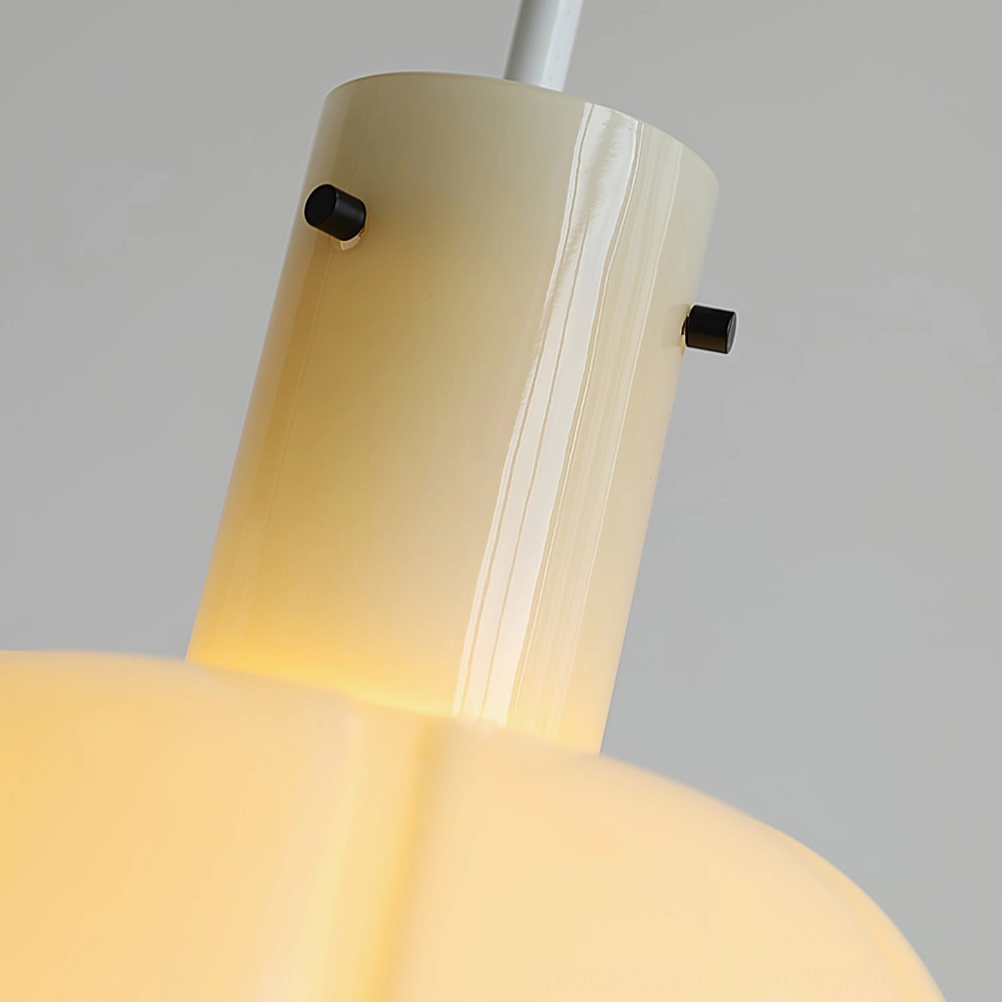 Frosted white Paolina pendant light creating soft ambient light in bedroom interior space