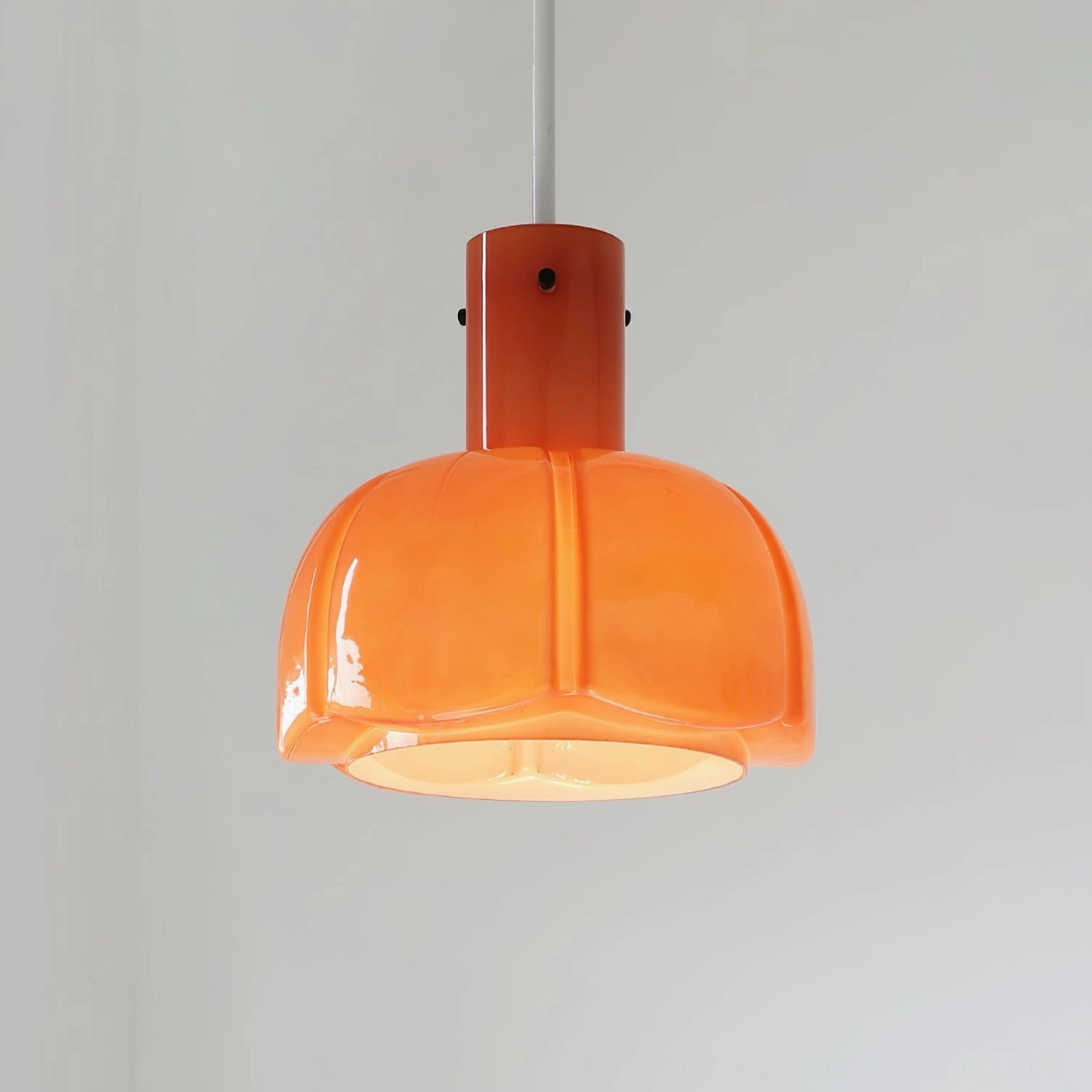 Frosted white Paolina glass pendant light in hallway entryway creating sophisticated first impression