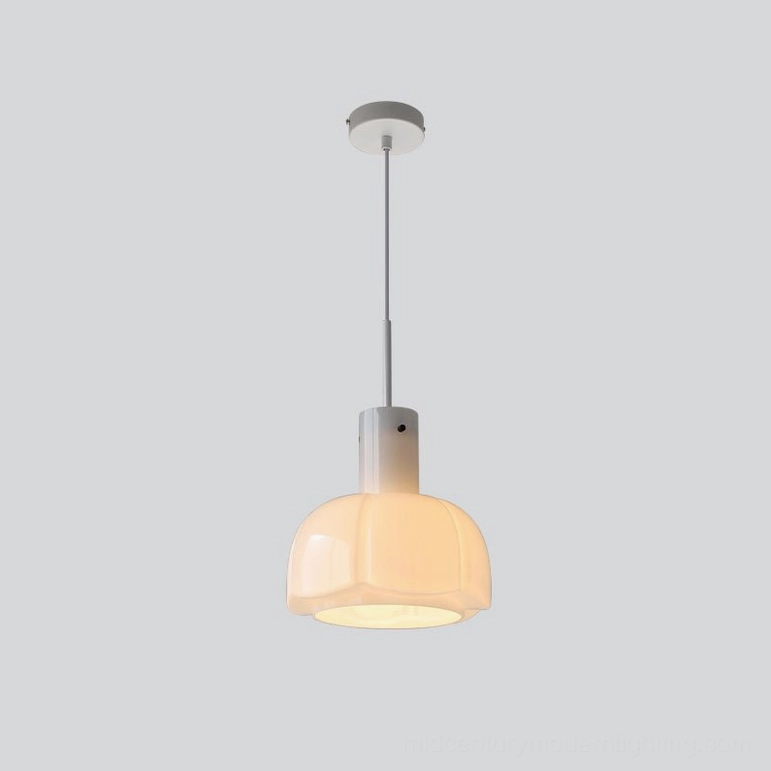 Orange Paolina glass pendant light in breakfast bar seating area warm ambiance setting