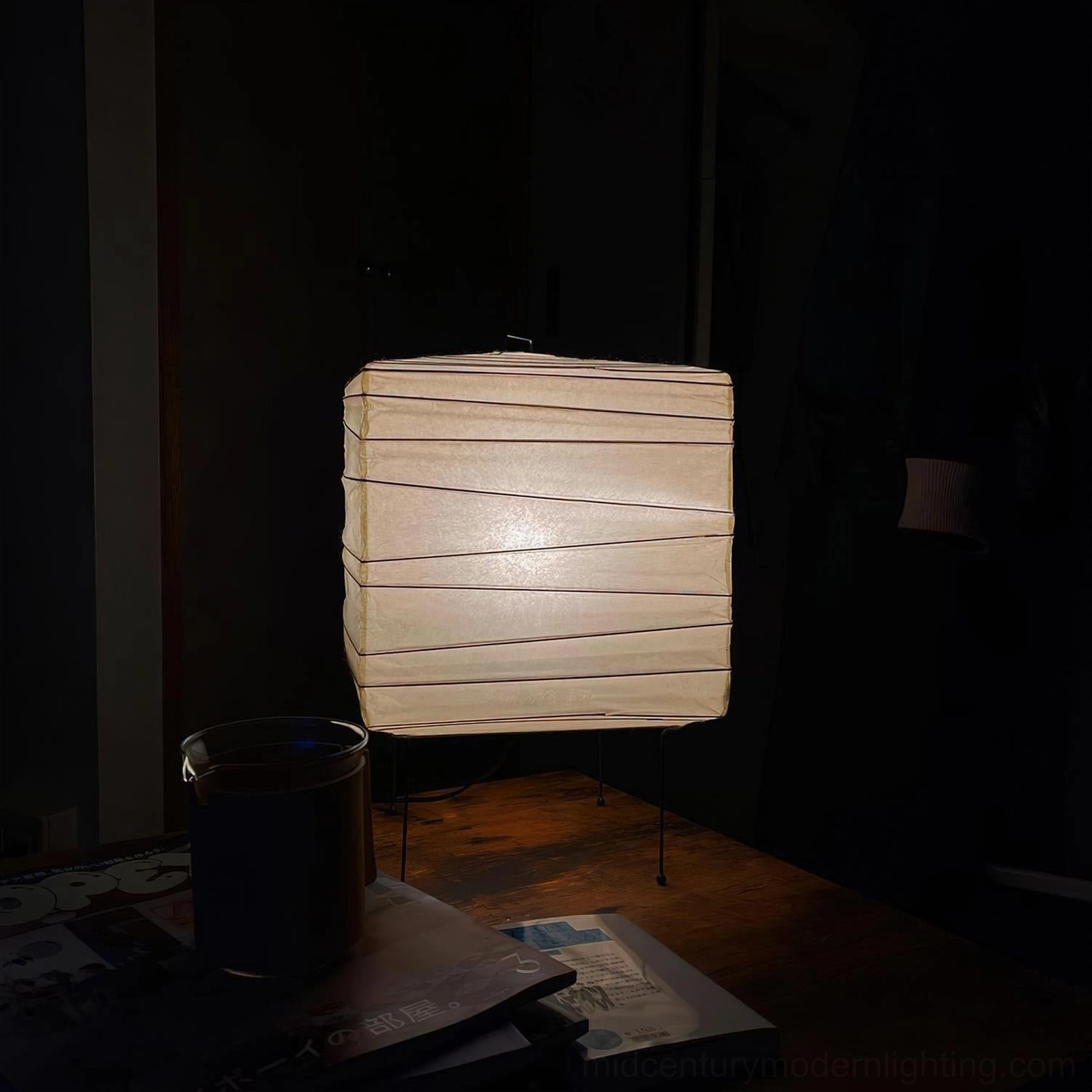 Organic paper lamp shade detail highlighting artisanal hand-bonded mulberry paper construction and sculptural perforated aperture design
