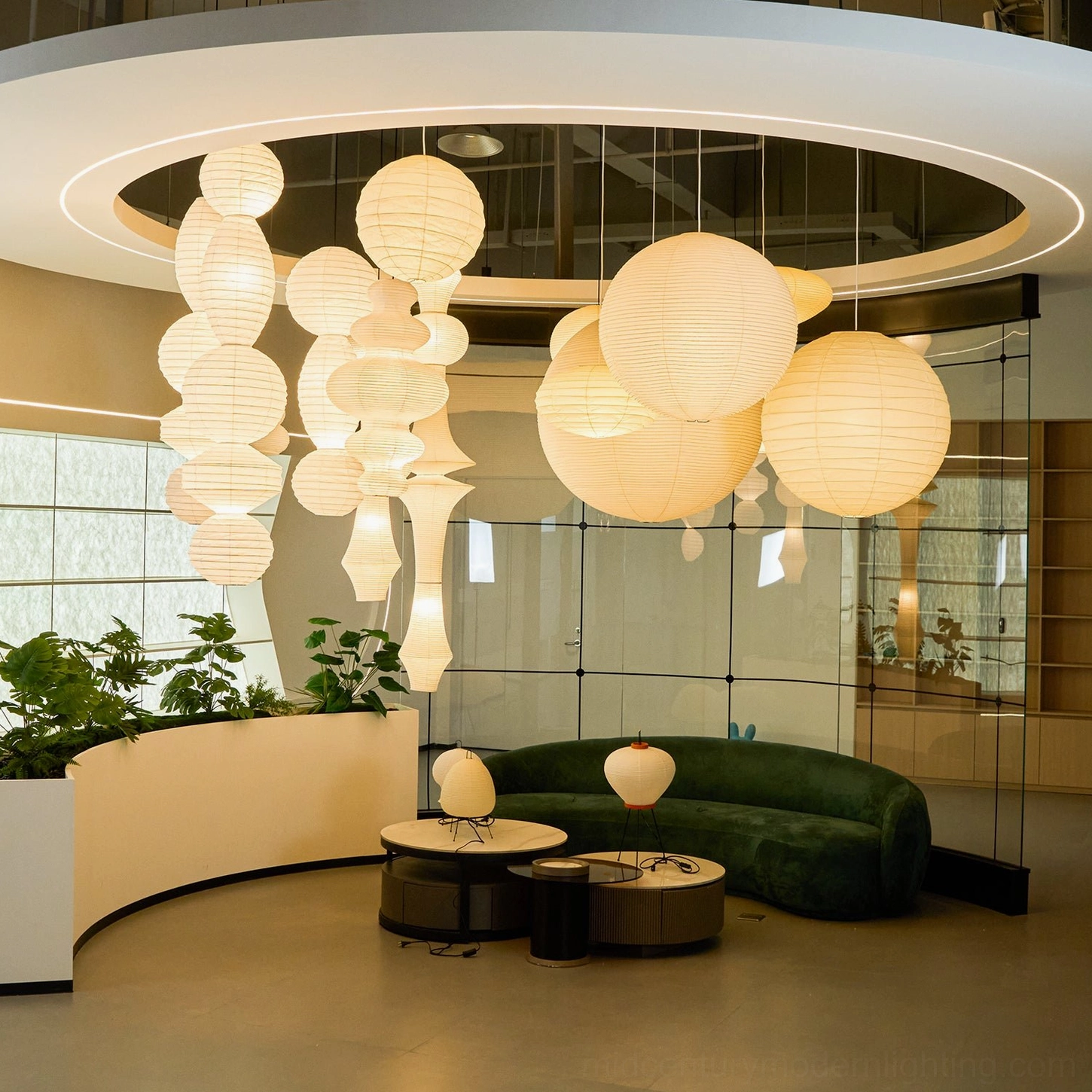 Cluster paper pendant lamps overhead view modern lounge green sofa ambient lighting