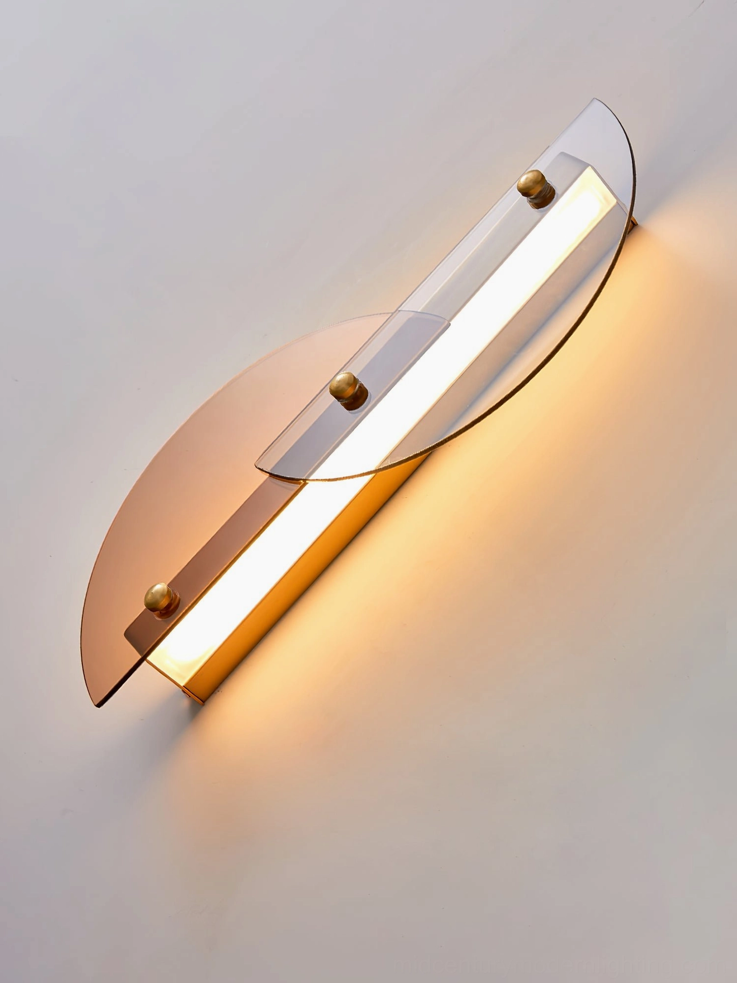 Papillon LED wall lamp close-up translucent amber acrylic brass fasteners detail