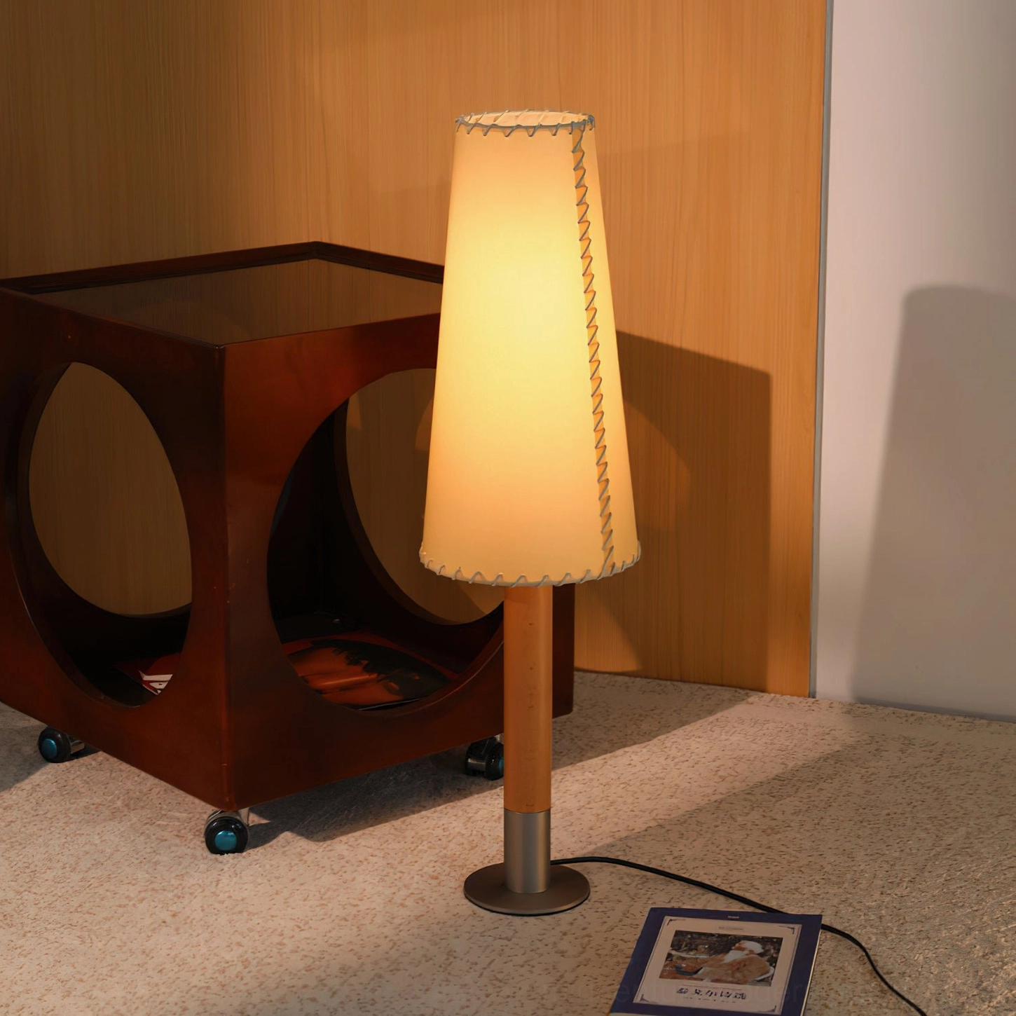 Mid-century modern parchment floor lamp creating warm ambient lighting in contemporary living room