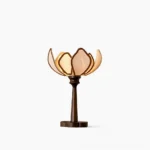 Pauline lotus table lamp front view with milky semi-transparent petal-shaped fabric shade and walnut wood base, studio white background