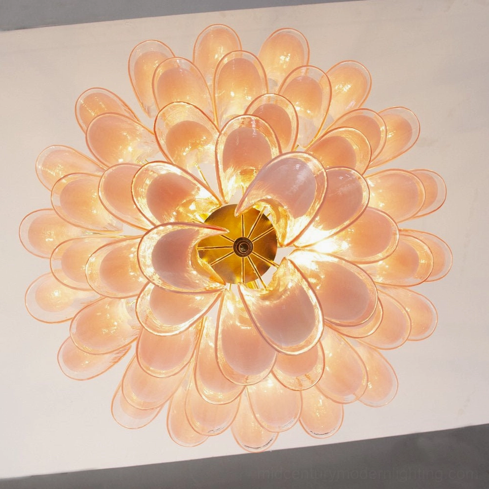 Peach Orange Petal Rain Chandelier illuminated, warm floral glow, golden base fixture