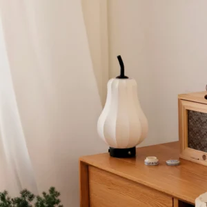 Pear wireless battery lamp styled on vintage bedroom dresser with retro radio and decorative accessories