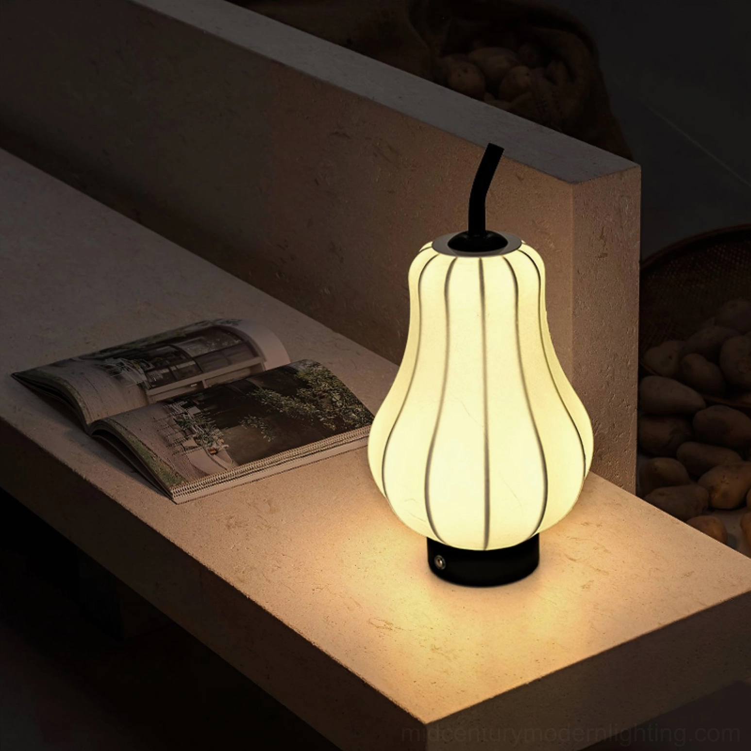 Compact cordless pear lamp with imitation silk shade interior glow shot