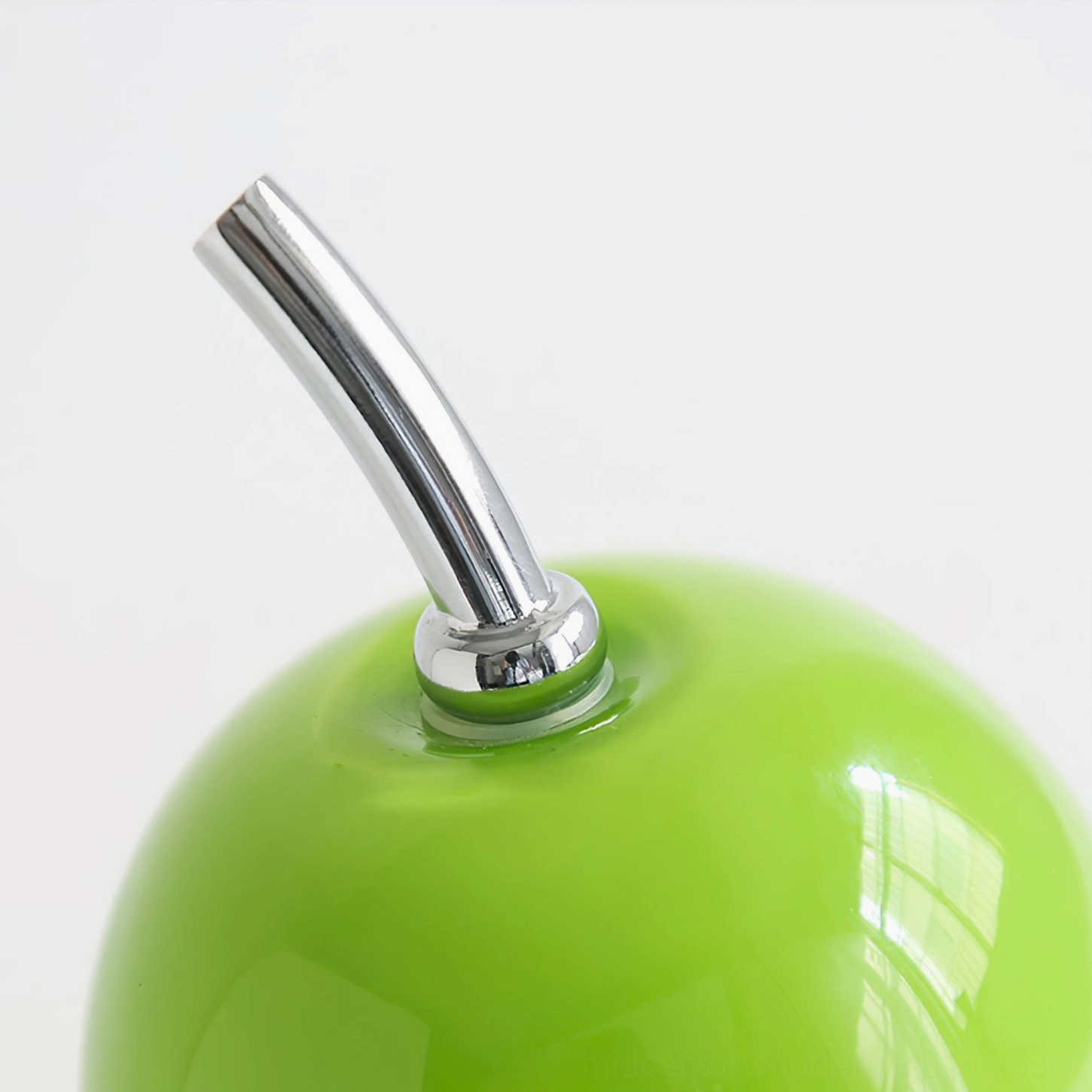 Modern pear-shaped glass table lamp with built-in battery, showing warm illumination and design elegance in interior setting