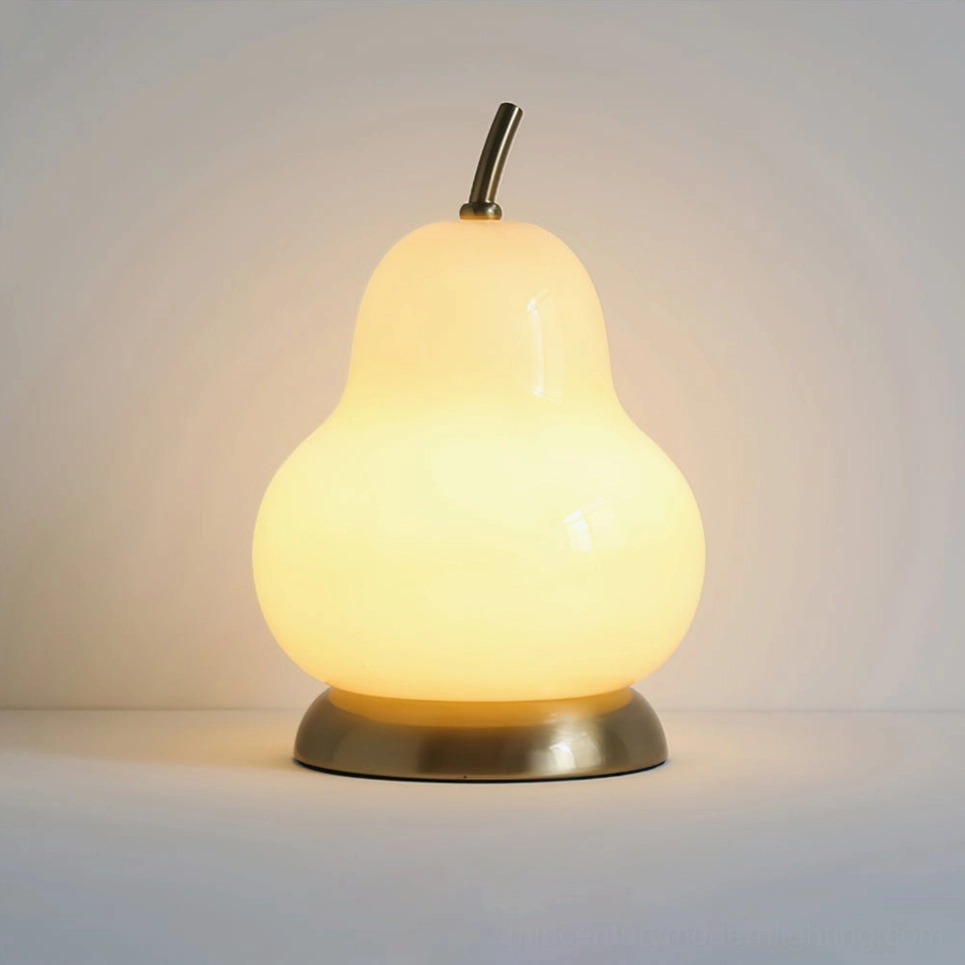 Rechargeable pear glass ambient lamp with touch control, sculptural form glowing softly on decorative surface