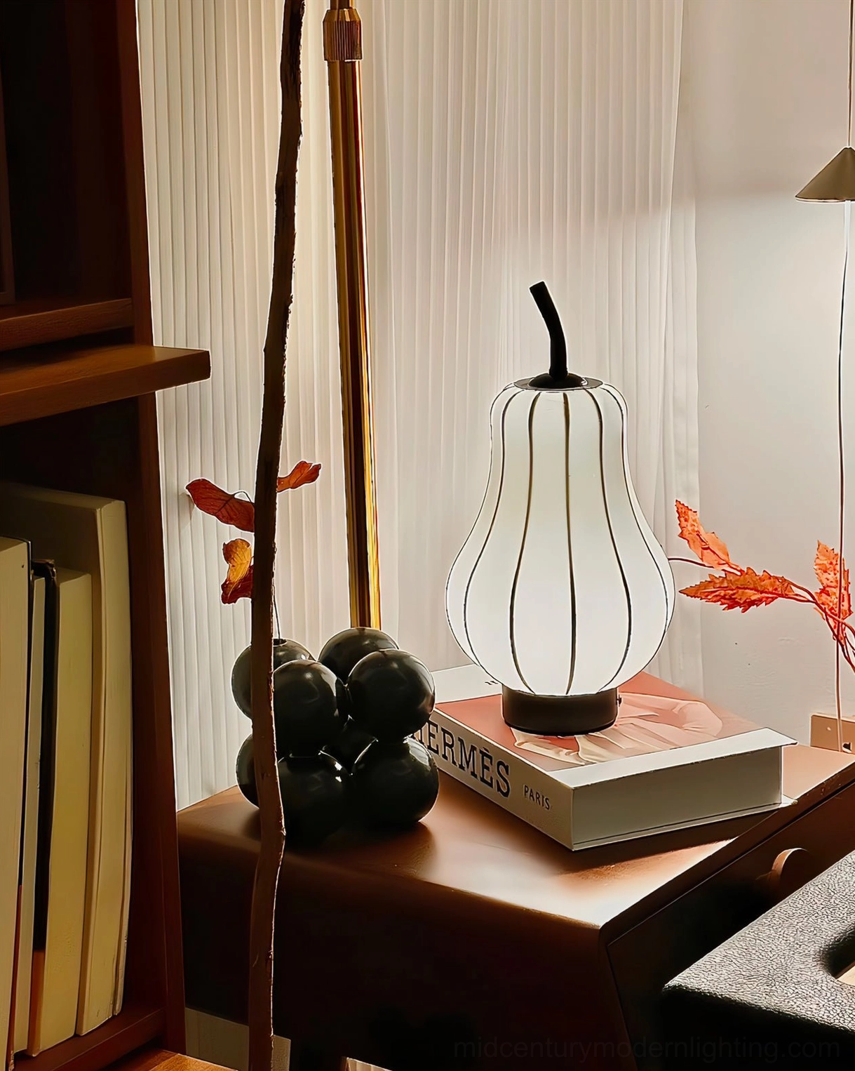 Pear wireless table lamp with integrated LED in home office workspace setting