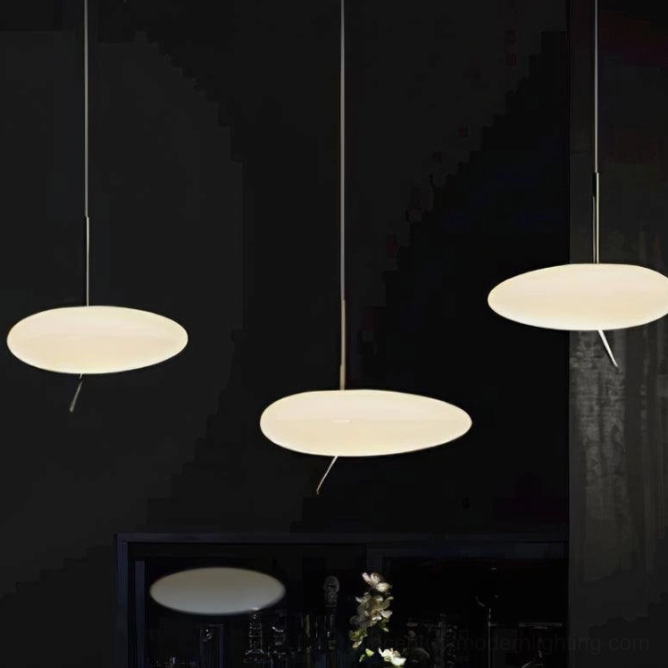 Pebbles pendant light with acrylic shade creating soft diffused glow in contemporary home setting