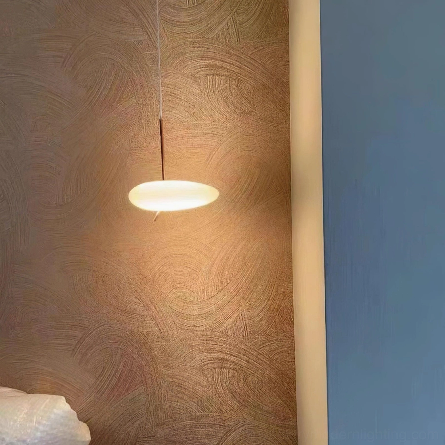 Pebbles pendant light demonstrating flexible cable adjustment and customizable hanging height