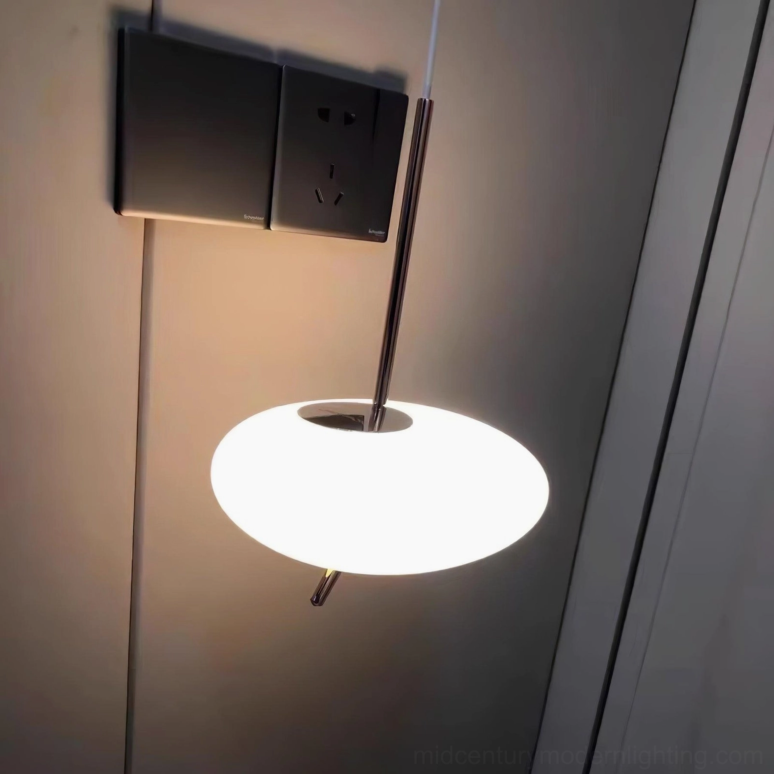 Modern pebbles pendant light in minimalist white interior with clean lines and gallery aesthetic
