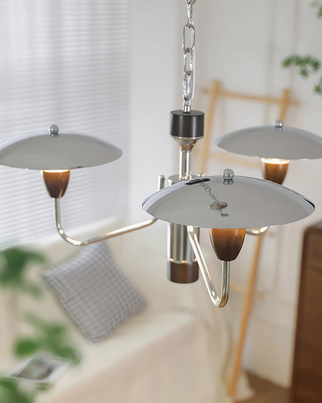 Peggy chrome chandelier polished metal finish detail, highlighting mid-century modern craftsmanship and material quality