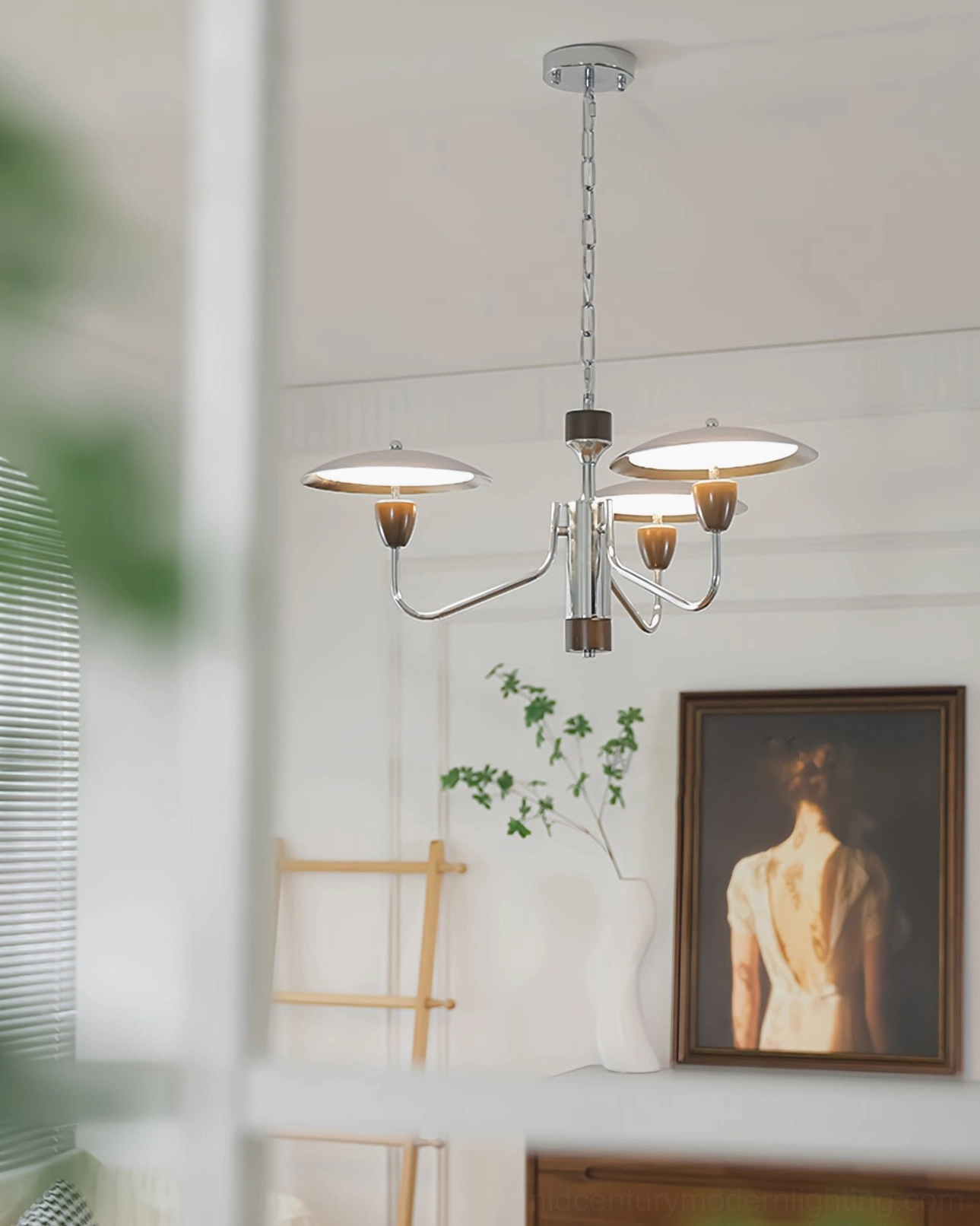 Peggy 4-light mid-century modern chandelier in minimalist living room with wall art and potted plant, contemporary interior styling