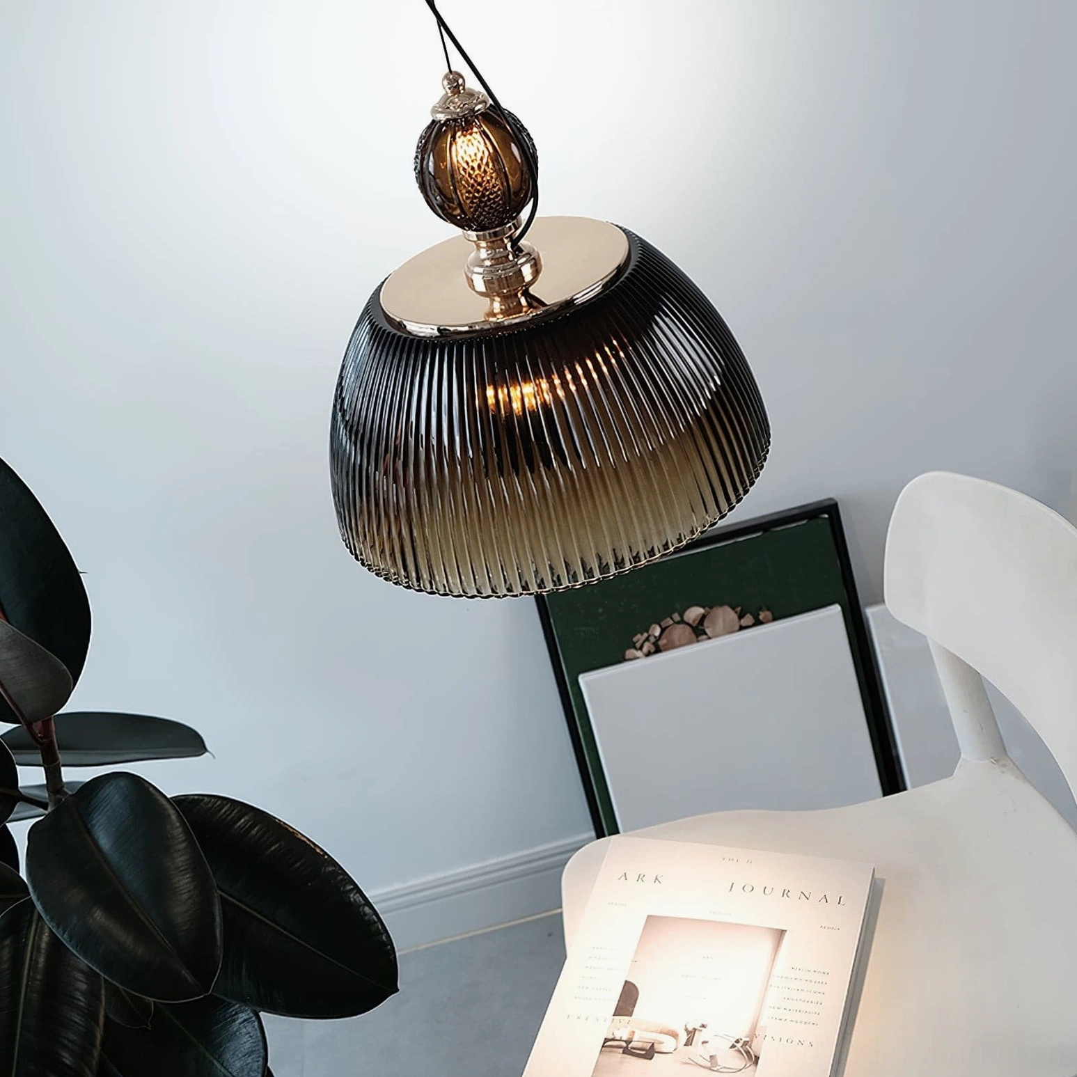 Pendant lamp suspended from ceiling showing how forest green or brown glass creates color depth effect