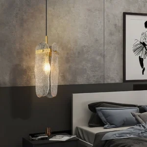 Modern pendant light in contemporary bedroom setting with ambient warm lighting and grey decor