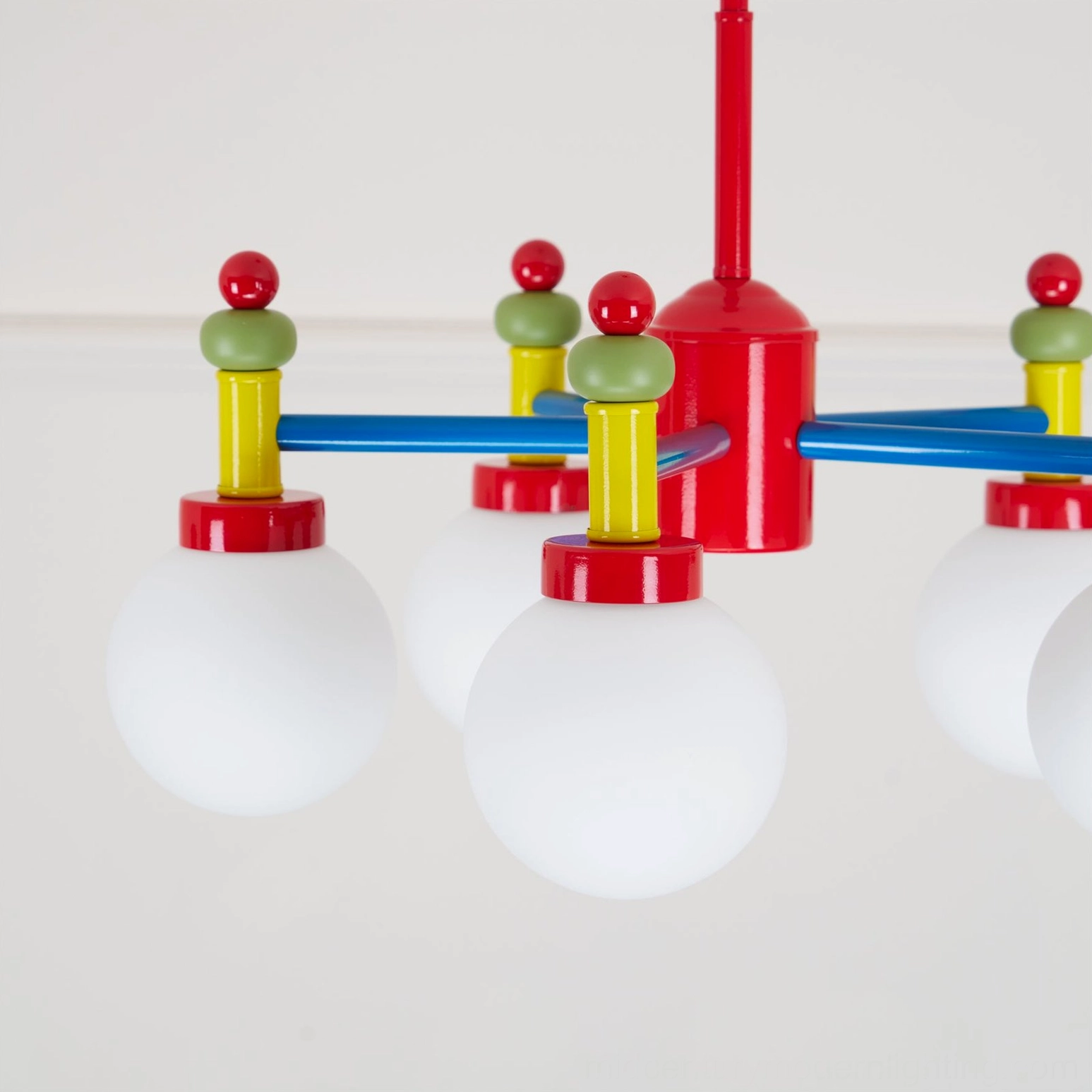Colorful pendant lamp detail showing glass diffuser quality and bulb integration