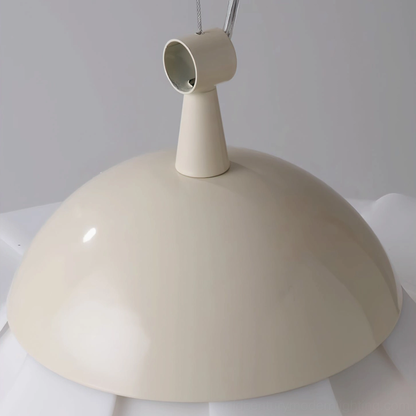 Close-up of pendant lamp suspension hardware and off-white painted metal components