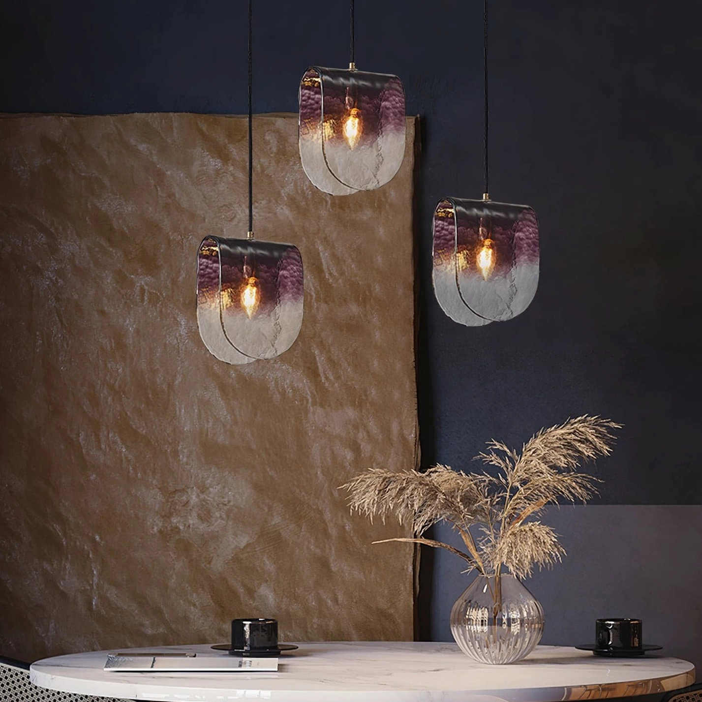 Modern pendant light installation in dining area showing artistic glass and ambient illumination