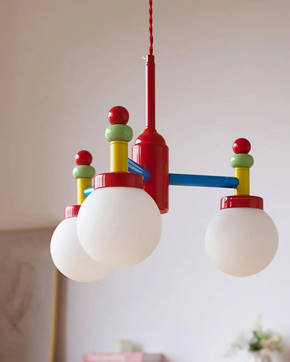 Three-quarter side view of unlit frosted glass pendant shade fixture in minimalist space