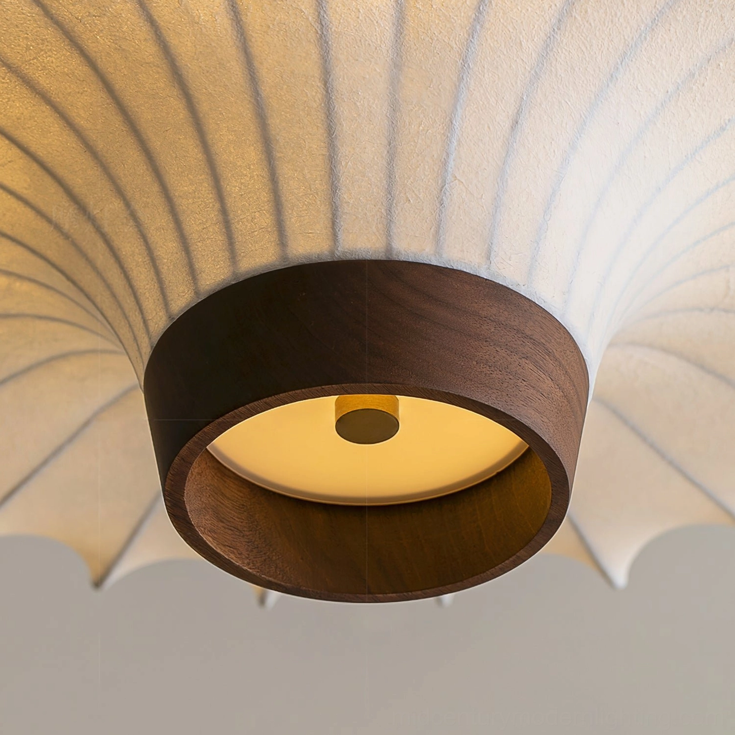 Pendant light interior lighting mechanism with warm yellow ambient glow and wooden trim frame, upward bottom close-up