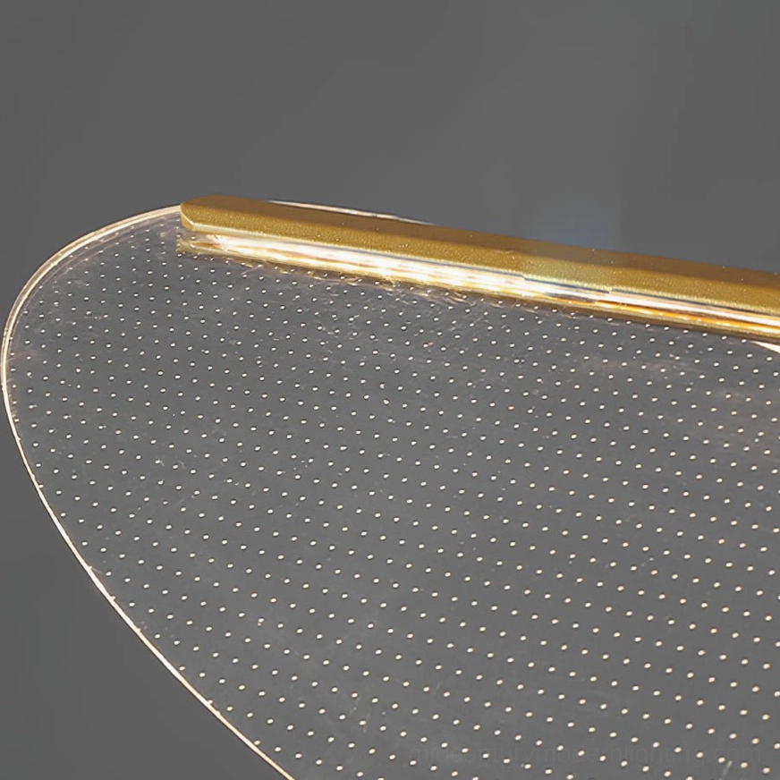 Close-up detail of dot-matrix perforated frosted shade with gold metal trim ring