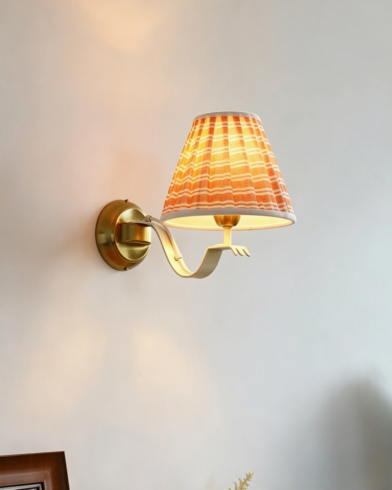 Penelope pleated wall sconce close-up frontal view showcasing striped fabric shade and minimalist brass gold finish