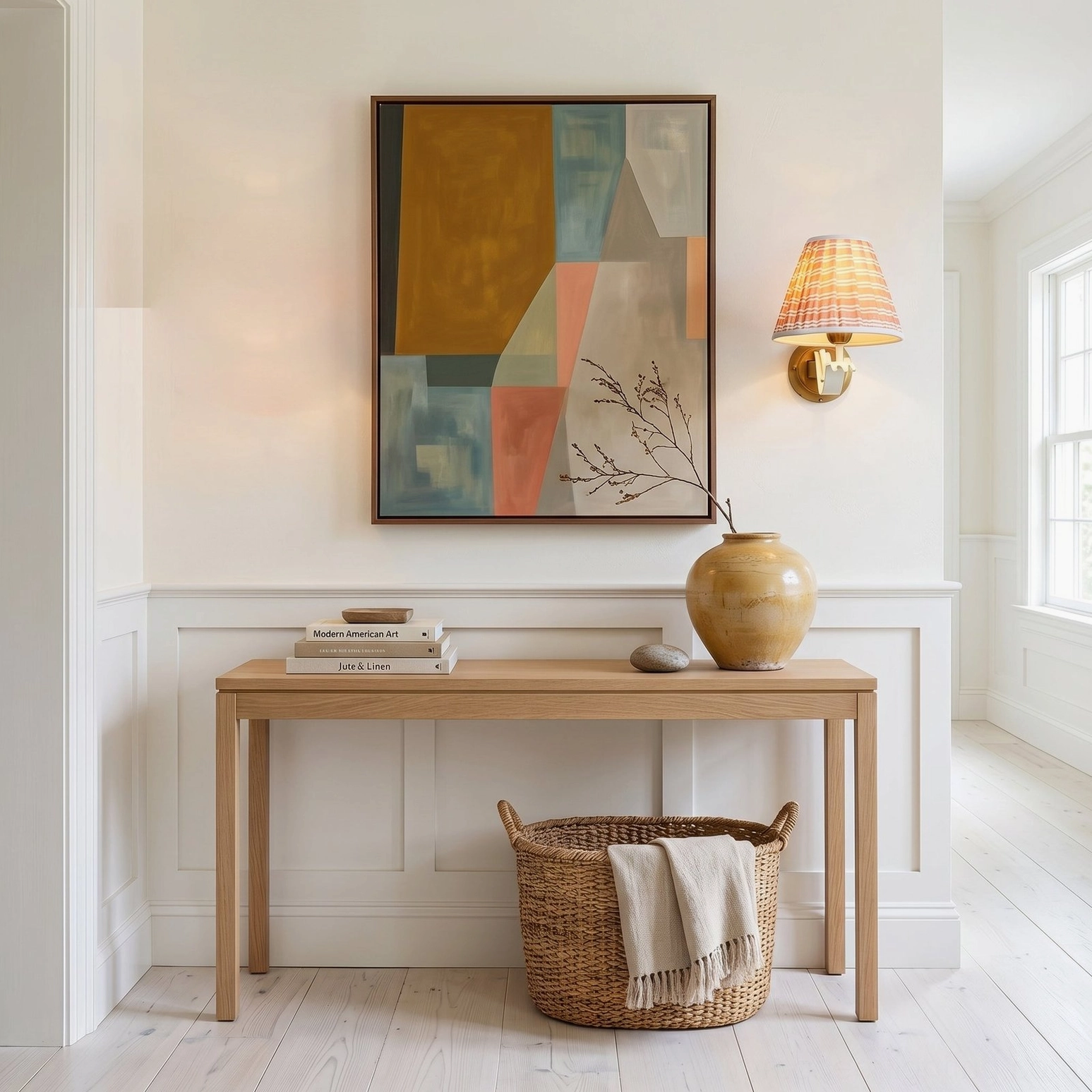 Penelope pleated wall sconce in hallway home entryway console area with neutral tone abstract wall art