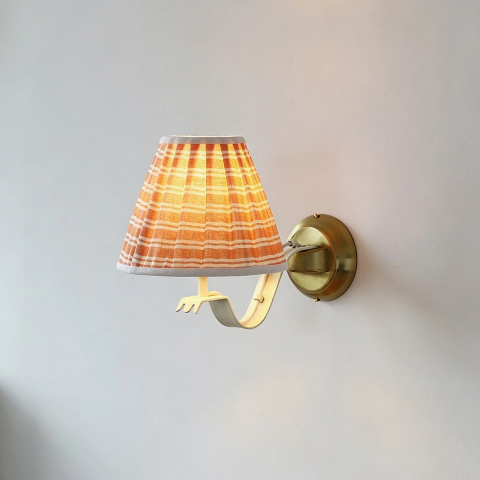 Penelope wall sconce in transitional interior design with mixed metal finishes and contemporary styling