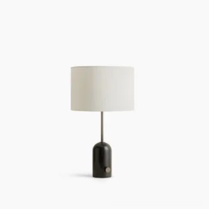 Penn marble table lamp with black marble base and white fabric shade, front view on white surface