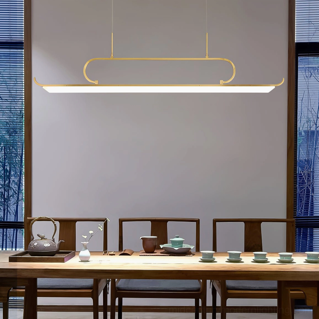 Penna linear LED chandelier in modern dining room with large windows, showing clean metal lines and warm ambient LED lighting
