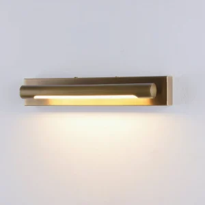 Penrith Linear Brass Wall Sconce medium length glowing warm illumination on white wall