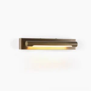 Penrith Linear Brass Wall Sconce short length model lit with warm LED light on white background