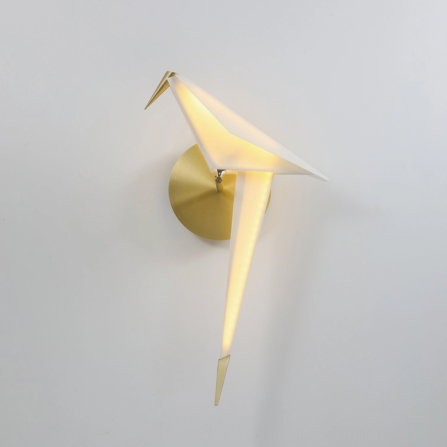 Side-angle view of perching bird wall lamp showing elegant bird form with integrated warm LED lighting and sleek design
