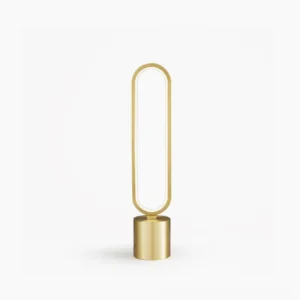 Perigee modern LED table lamp with brushed brass finish and oval acrylic diffuser on white background