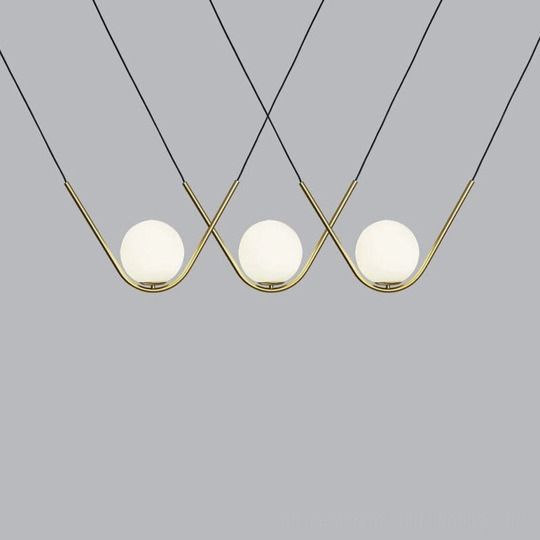 Perle multi-pendant system showing complete three-head installation with coordinated frosted glass shades