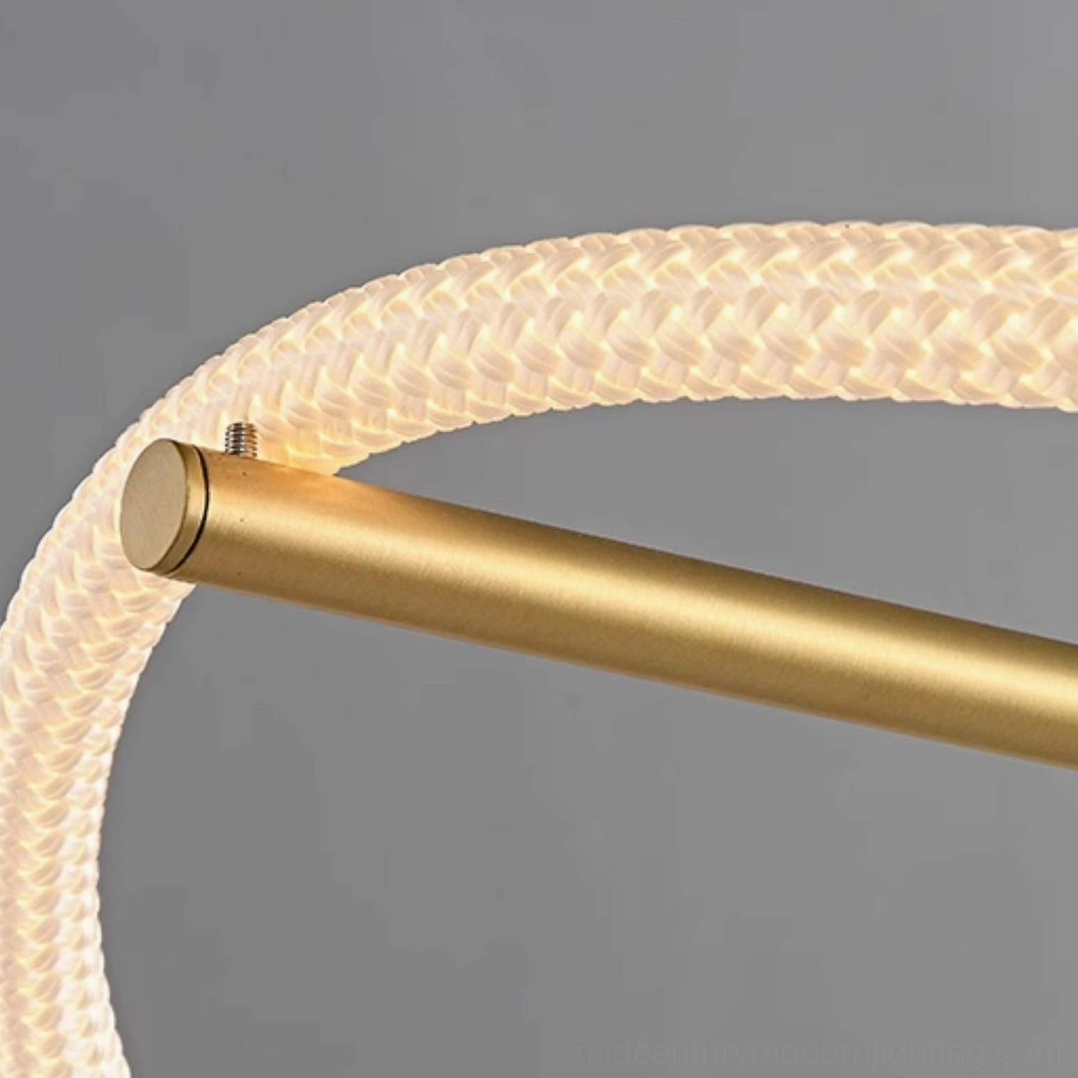Detail of Perpetual Infinity Pendant Lamp assembly joint showing braided LED rope and brass mounting rod connection