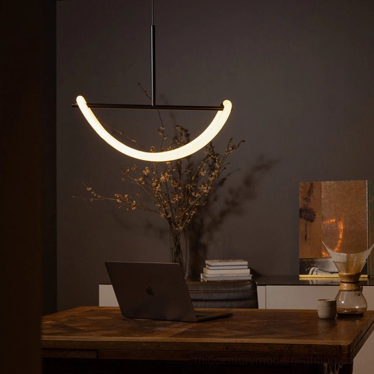 Matte black Perpetual Infinity Pendant Lamp in minimalist home office with sculptural loop design and focused light