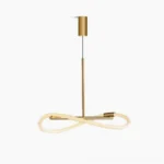 Perpetual Infinity Pendant Lamp in brushed brass - sculptural loop design with integrated LED, side-front studio view