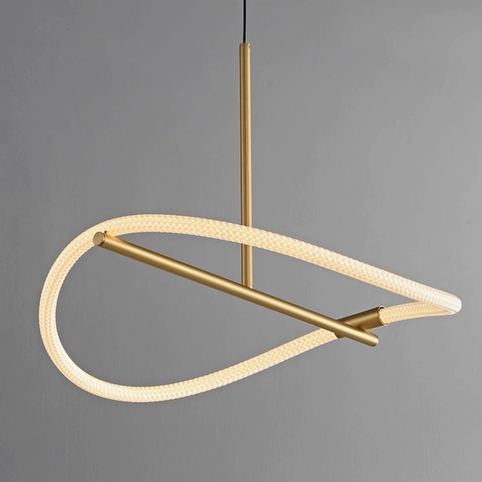 Perpetual Infinity Pendant Lamp irregular twisted loop design in brushed brass - side perspective studio shot