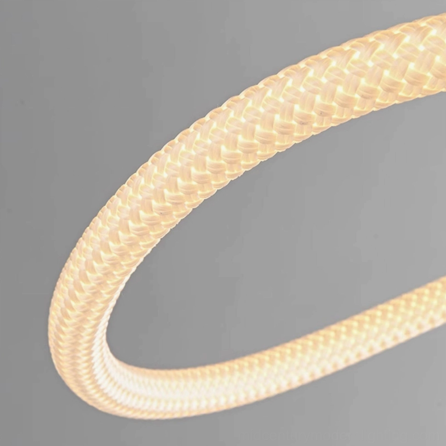 Close-up detail of Perpetual Infinity Pendant Lamp integrated LED strip with braided protective sleeve