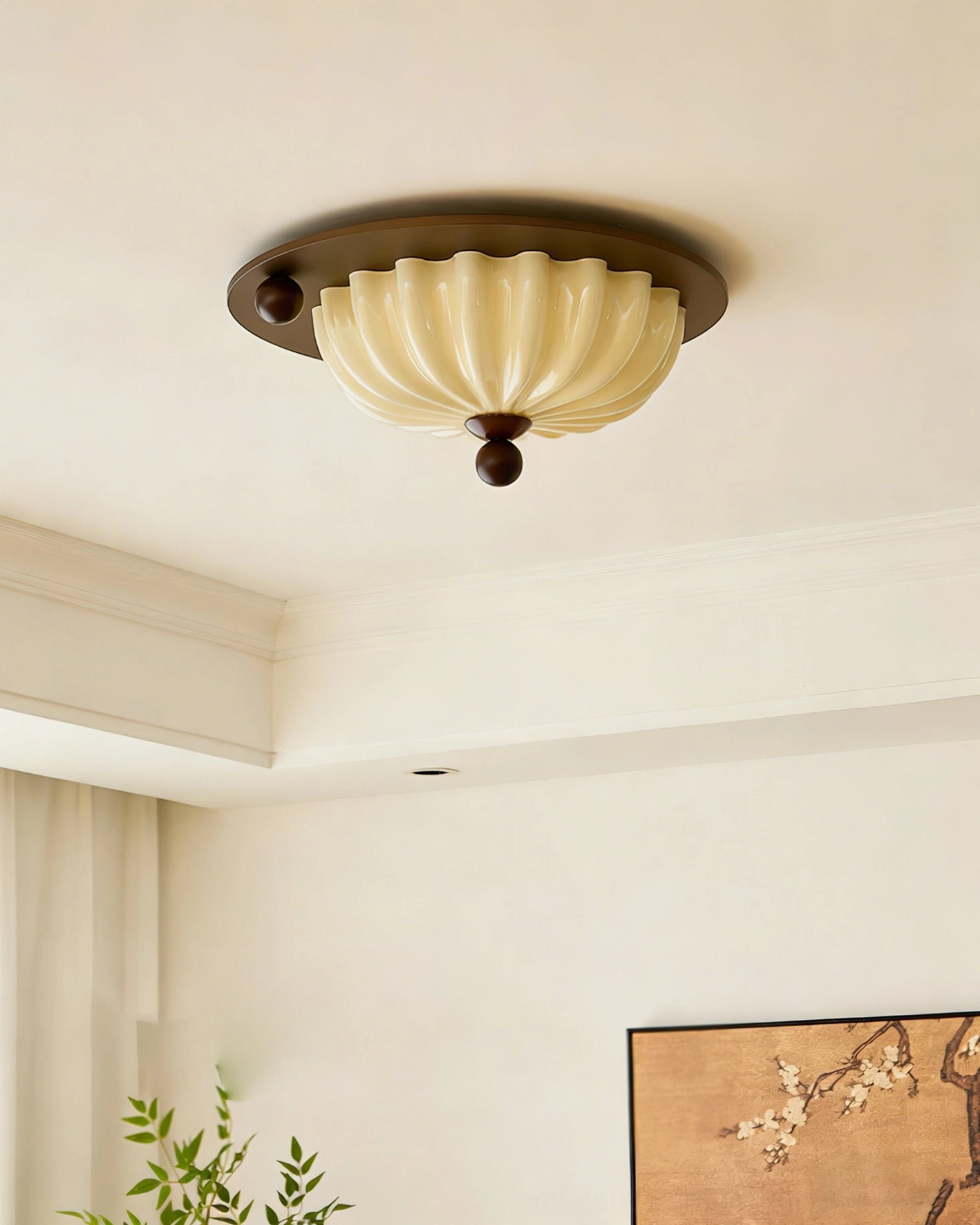 Perth mid-century modern ceiling light installed in minimalist bedroom with dark metal accents, low-angle view