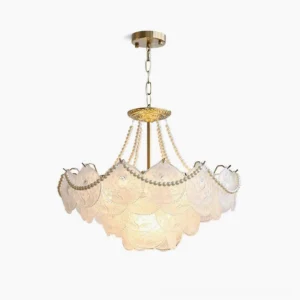 Pertid chandelier with frosted embossed glass layers and brass gold frame, front view on white studio backdrop